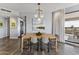 Bright dining room features modern lighting, light wood table, and access to the terrace at 1040 E Osborn Rd # 1103, Phoenix, AZ 85014