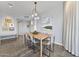 Bright dining room features modern lighting and light wood table at 1040 E Osborn Rd # 1103, Phoenix, AZ 85014