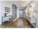 Contemporary condo foyer with neutral walls, tile floors, and decorative lighting fixtures at 1040 E Osborn Rd # 1103, Phoenix, AZ 85014