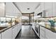 Stylish modern kitchen features sleek cabinetry, granite counters and a great view at 1040 E Osborn Rd # 1103, Phoenix, AZ 85014