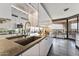 Modern kitchen boasts granite counters, sleek appliances, and a view of the terrace at 1040 E Osborn Rd # 1103, Phoenix, AZ 85014