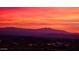 Breathtaking sunset view featuring vibrant colors over mountain silhouettes, a serene backdrop for relaxation at 1040 E Osborn Rd # 1103, Phoenix, AZ 85014