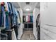 Spacious walk-in closet with custom shelving and ample storage space for clothing and accessories at 1040 E Osborn Rd # 1103, Phoenix, AZ 85014