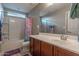 Bright bathroom with a tub/shower combination and a large mirror above the vanity at 10850 W Bronco Trl, Peoria, AZ 85383