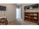 A carpeted bedroom area leads to a walk-in closet and features a media center, offering great storage at 10850 W Bronco Trl, Peoria, AZ 85383