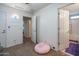 Bedroom featuring neutral tones, a ceiling fan, and multiple doorways at 10850 W Bronco Trl, Peoria, AZ 85383