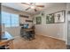 A bedroom features a custom-designed desk and decor, with a window providing natural light at 10850 W Bronco Trl, Peoria, AZ 85383
