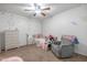 Cozy bedroom with star decals, ceiling fan, and comfortable furniture at 10850 W Bronco Trl, Peoria, AZ 85383