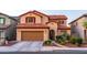 Charming two-story home with a well-maintained lawn, desert landscaping, and a two car garage at 10850 W Bronco Trl, Peoria, AZ 85383