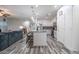 Open-concept kitchen with a large island, stainless steel appliances, and seamless access to the living area at 10850 W Bronco Trl, Peoria, AZ 85383
