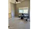 View of a bedroom with neutral colored walls, a ceiling fan, carpet, and a window at 11001 Clear Water --, Goodyear, AZ 85338