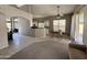 Open floor plan showcasing living room, dining area, and kitchen, creating an inviting living space at 11001 Clear Water --, Goodyear, AZ 85338