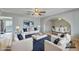 Bright living room with neutral tones, stylish furniture, and arched entryway to the dining area at 1243 E Susan Ln, Tempe, AZ 85288