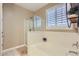 Bright bathroom showcases a soaking tub and glass-enclosed shower at 13811 W Paso Trl, Peoria, AZ 85383