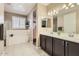 Well-lit bathroom features a soaking tub, a step-in shower, and a dual sink vanity at 13811 W Paso Trl, Peoria, AZ 85383