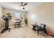 Bonus room features a home gym and dedicated workspace with modern furniture at 13811 W Paso Trl, Peoria, AZ 85383