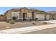 Charming single-story home with a well-manicured yard and a three car garage at 13811 W Paso Trl, Peoria, AZ 85383