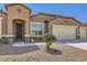 Welcoming front entrance with decorative security door and low maintenance desert landscaping at 13811 W Paso Trl, Peoria, AZ 85383