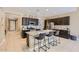 Modern kitchen with stainless steel appliances, granite countertops, and a large island at 13811 W Paso Trl, Peoria, AZ 85383