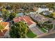 Stunning waterfront house with a tile roof, three-car garage, and beautifully landscaped front yard at 1507 E Treasure Cove Dr, Gilbert, AZ 85234