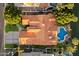 Aerial view of roof, pool, backyard, and landscaping of lakefront property at 1507 E Treasure Cove Dr, Gilbert, AZ 85234