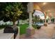 Inviting covered patio with picturesque water views, outdoor kitchen, and an outdoor swimming pool at 1507 E Treasure Cove Dr, Gilbert, AZ 85234