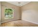 Bright bedroom with hardwood floors and natural light from a beautiful window at 1507 E Treasure Cove Dr, Gilbert, AZ 85234