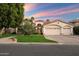 Stunning home featuring a three-car garage and beautiful desert landscaping at 1507 E Treasure Cove Dr, Gilbert, AZ 85234