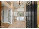 Bright foyer with marble floors, chandelier, and views to the backyard at 1507 E Treasure Cove Dr, Gilbert, AZ 85234
