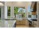 Charming kitchen with views of the lake featuring stainless appliances and custom cabinetry at 1507 E Treasure Cove Dr, Gilbert, AZ 85234