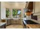 Bright, open kitchen with stainless appliances, custom cabinetry, and lake views at 1507 E Treasure Cove Dr, Gilbert, AZ 85234