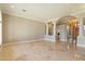 Open living room with marble flooring and decorative pillars at 1507 E Treasure Cove Dr, Gilbert, AZ 85234