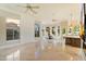 Bright, open living area with tile floors, ceiling fans, and a breakfast nook at 1507 E Treasure Cove Dr, Gilbert, AZ 85234