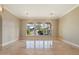 Spacious living room with large windows overlooking backyard pool at 1507 E Treasure Cove Dr, Gilbert, AZ 85234