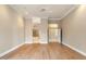 Open living room space with hardwood floors, neutral paint, and walk-in bath at 1507 E Treasure Cove Dr, Gilbert, AZ 85234