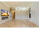 Bright living room features high ceilings, tile floors, a linear fireplace and a flatscreen TV at 1507 E Treasure Cove Dr, Gilbert, AZ 85234