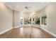 Bright living room featuring hardwood floors, large arched windows, and water view at 1507 E Treasure Cove Dr, Gilbert, AZ 85234