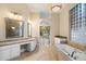 Spacious bathroom with dual vanities, soaking tub, and natural light at 1507 E Treasure Cove Dr, Gilbert, AZ 85234