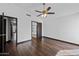 Spacious bedroom featuring a ceiling fan, hardwood floors, and ensuite bathroom at 16044 S 41St Pl, Phoenix, AZ 85048