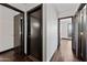 Hallway with hard wood floors and doors to multiple rooms at 16044 S 41St Pl, Phoenix, AZ 85048