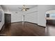 Open concept living area with rich hardwood floors and a ceiling fan at 16044 S 41St Pl, Phoenix, AZ 85048