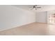 Spacious bedroom with neutral walls, tile floors, and natural light at 1701 W Tuckey Ln # 231, Phoenix, AZ 85015