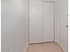 Hallway featuring tile floors, and a coat closet at 1701 W Tuckey Ln # 231, Phoenix, AZ 85015