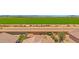 An aerial view showing a home and its fenced backyard with desert landscaping at 17418 N Carmen Ave, Maricopa, AZ 85139