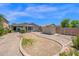 Spacious backyard featuring desert landscaping, stone walkways, and a shed at 17418 N Carmen Ave, Maricopa, AZ 85139