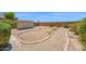 Large backyard featuring mature desert landscaping and storage shed at 17418 N Carmen Ave, Maricopa, AZ 85139