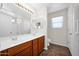 Bright bathroom with double sink vanity, large mirror, and modern fixtures at 17418 N Carmen Ave, Maricopa, AZ 85139
