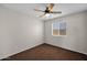 Cozy bedroom with ceiling fan and natural light from the window at 17418 N Carmen Ave, Maricopa, AZ 85139