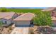 Charming single-story home with a well-maintained front yard at 17418 N Carmen Ave, Maricopa, AZ 85139