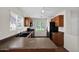 Kitchen featuring ample natural light, track lighting, dark appliances, and breakfast bar at 17418 N Carmen Ave, Maricopa, AZ 85139